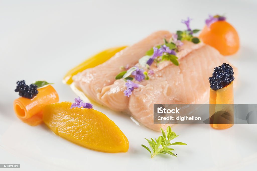 Delicious boiled salmon Boiled salmon with herbs and served with carrot puree. Shallow dof. Bull Trout Stock Photo
