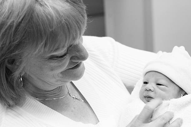 istock Grandma Meets Newborn 174896399