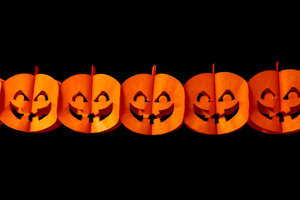 Halloween garland on black background.