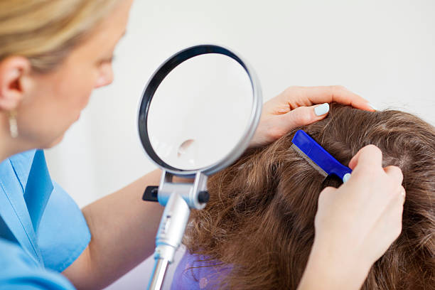 istock Woman inspect childs head for lice. 174896766
