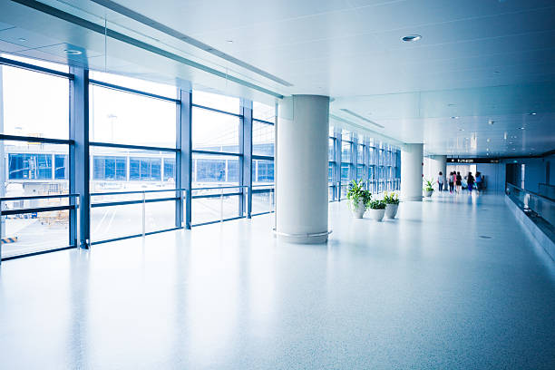 istock People walking in an airport corridor 174897059
