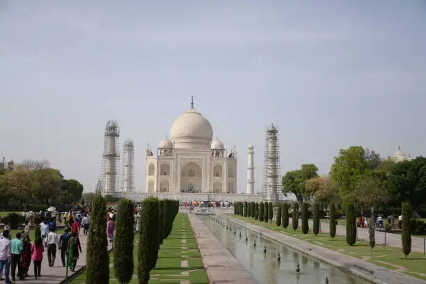 The Taj Mahal is an ivory-white marble mausoleum on the right bank of the river Yamuna in Agra, Uttar Pradesh, India. This photo was taken when taj mahal renovation work is on going.