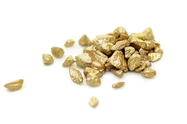 Pile of small gold nuggets isolated on pure white