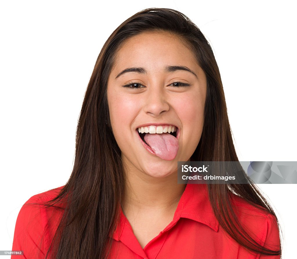 Teenage Girl Sticking Out Tongue Portrait of a teenage girl isolated on a white background. Teenage Girls Stock Photo
