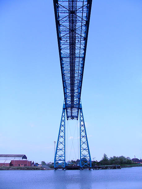 Middlesbrough Transporter Bridge A shot from the car of the Transporter Bridge across the river Tees, linking Middlesbrough with Port Clarence. Somehow this one came out showing the brilliant blue colour of the sky, river and bridge. teesside northeast england stock pictures, royalty-free photos & images