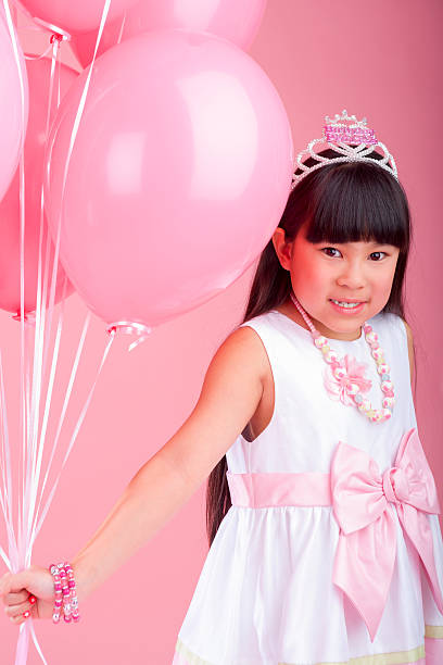 istock Birthday girl holding balloons 174898139