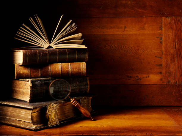 istock Hardback Books with a Magnifying Glass 174898226