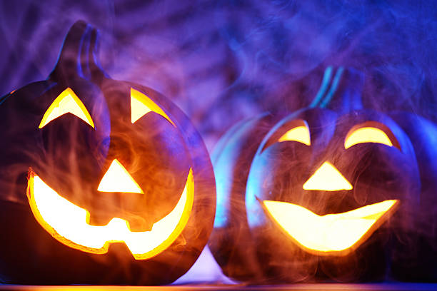 istock Halloween pumpkins in dark blue with spider web and smoke 174898963