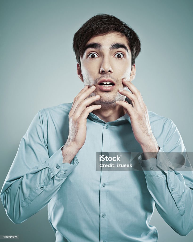 Scared Businessman Portrait of young scared businessman looking at the camera with his hand on forehead. 25-29 Years Stock Photo