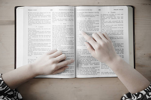 istock Woman reading from the Bible. 174899349
