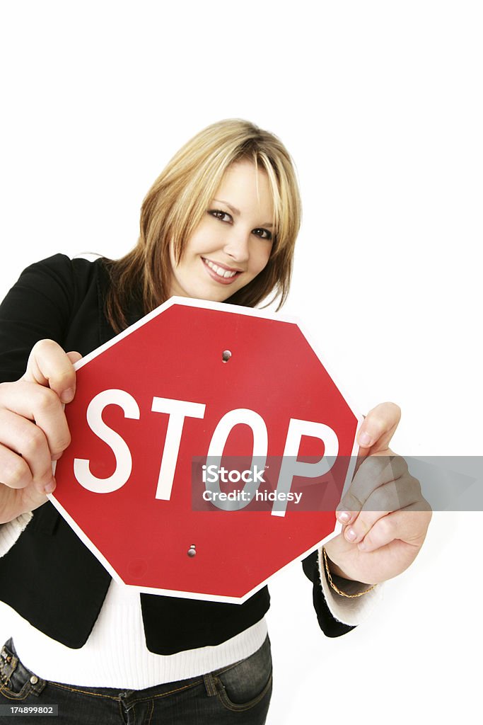 Stopper Woman holding stop sign 16-17 Years Stock Photo