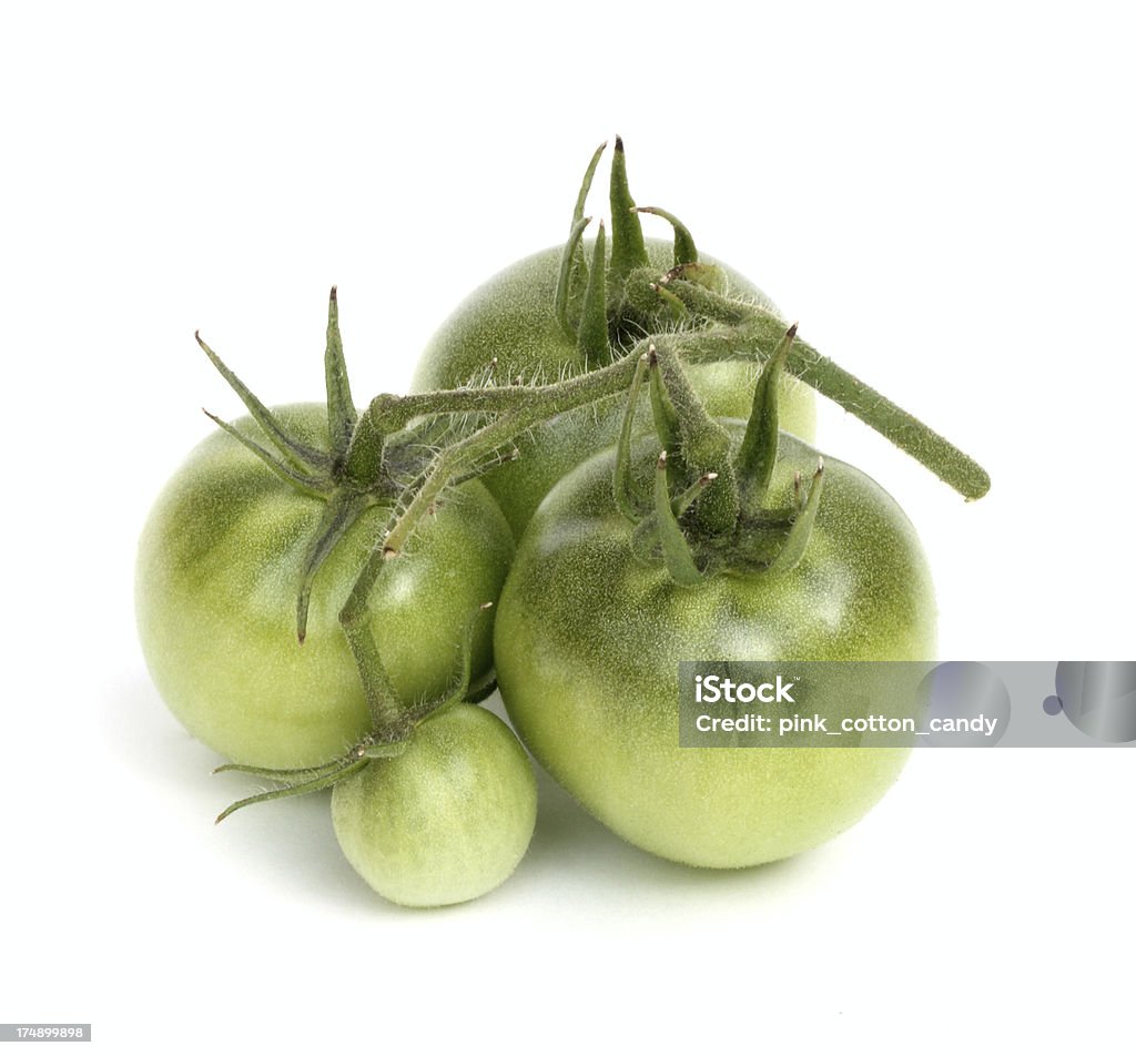 Green Tomatoes Straight from the vine...soon to be pickled Green Tomato Stock Photo