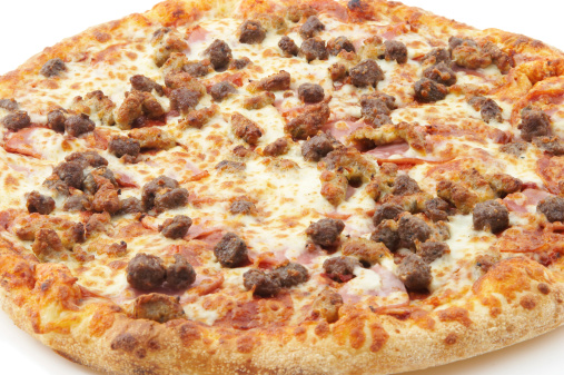 a meat lovers slice of pizza