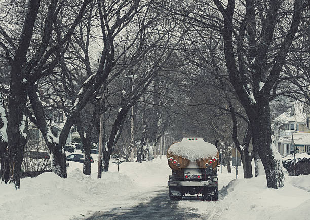 A home heating oil truck makes a delivery after a massive snowstorm.
