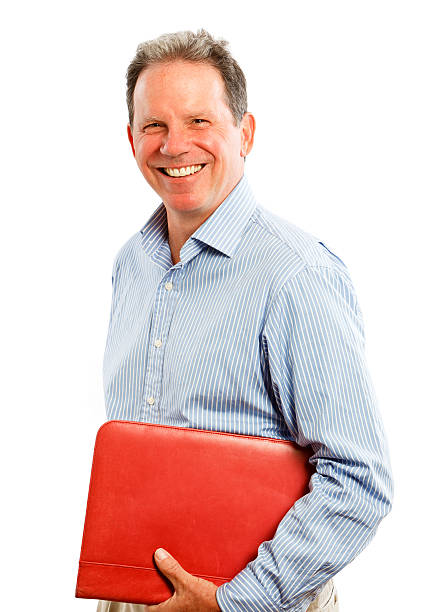istock Smiling middle-aged man holding a red binder on white. 174900238