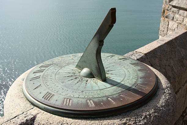 Ancient Sundial "The shadow of the sun reveals the time on an ancient sundial on the castle walls of Saint Michael's Mount, Cornwall, England.For more in this series, please see:" ancient sundial stock pictures, royalty-free photos & images