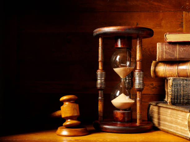 istock Gavel with a Hourglass and Antique Books 174900425