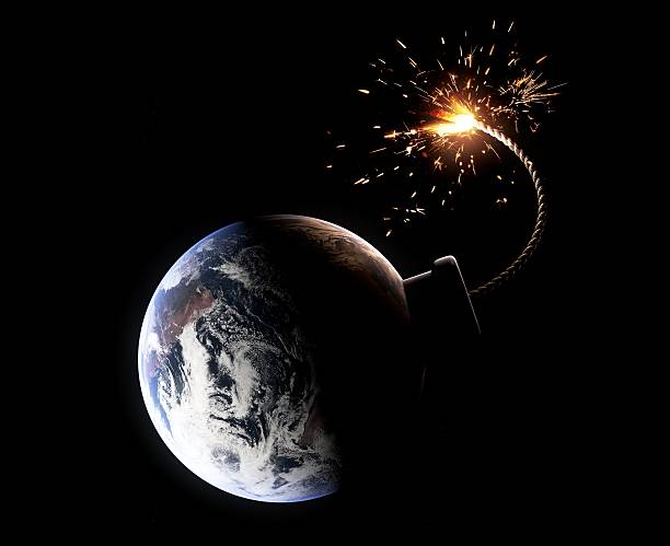 Earth about to explode (Doomsday concept) Detailed hi-res rendering of earth as a bomb with sparkling fuse. electrical fuse stock pictures, royalty-free photos & images