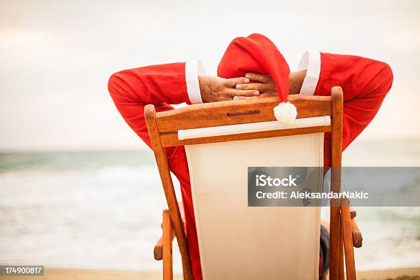 Santa On A Vacation Stock Photo - Download Image Now - Beach, Celebration Event, Christmas