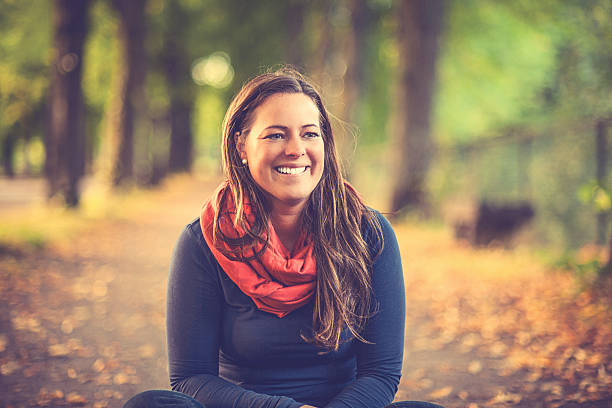 Woman in autumn parkway