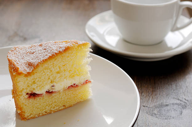 istock Slice of Victoria sponge cake with cup coffee. 174901056