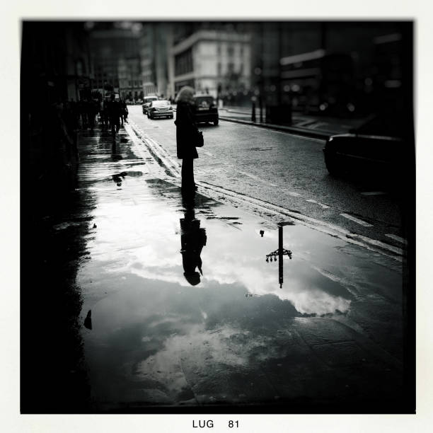 People walking in Oxford street after the rain. Taken with Iphone4 and Hipstmatic app.