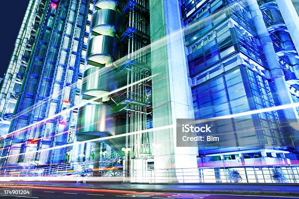 Illuminated Futuristic Architecture And Car Light Trails At Night London Stock Photo - Download Image Now