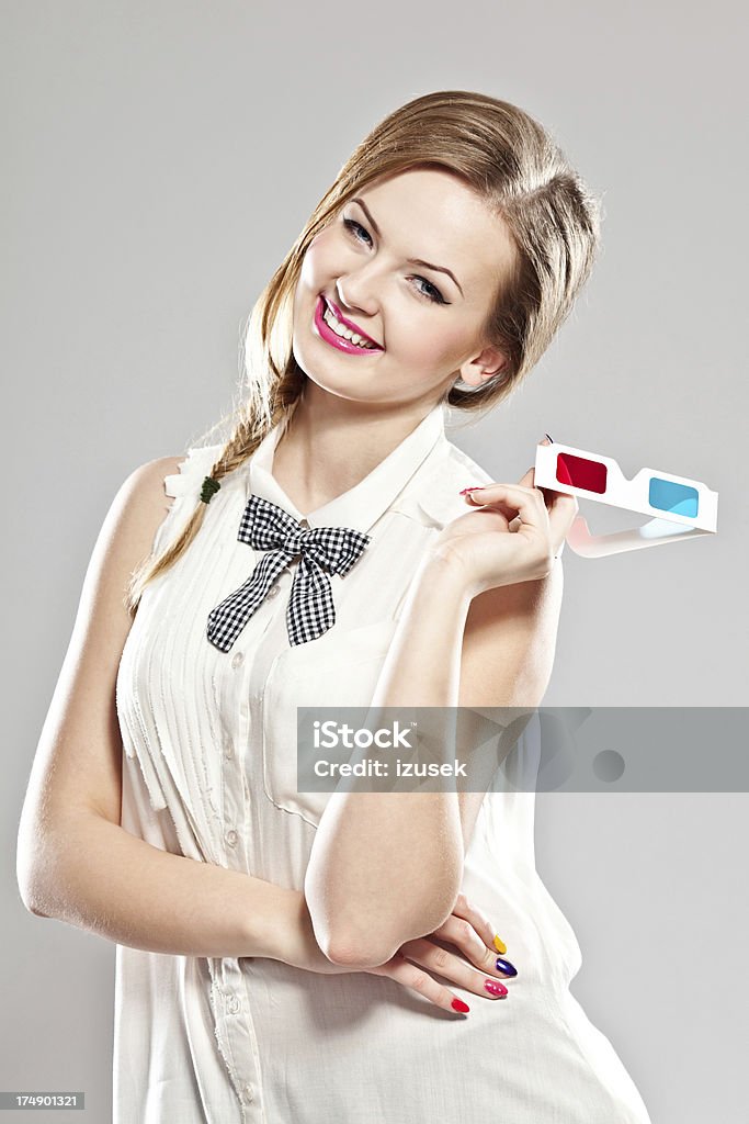 Happy young woman Portrait of happy young woman holding 3D glasses in her hand and laughing at the camera. 20-24 Years Stock Photo