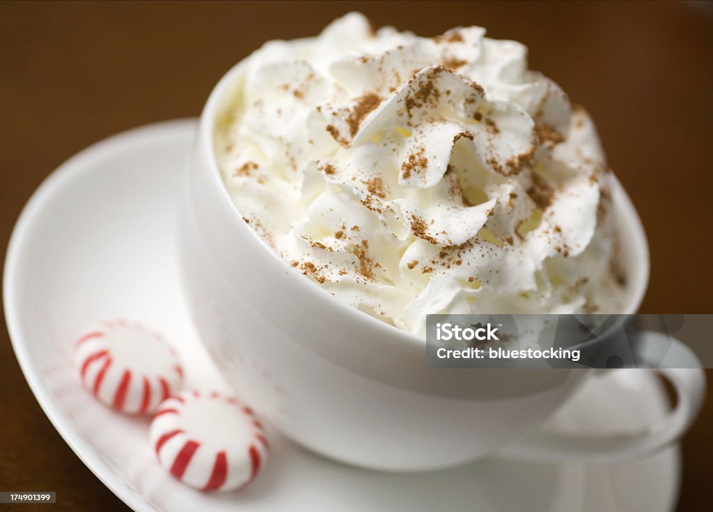 Hot Chocolate A delicious winter treat of hot chocolate or coffee with swirls of whipped cream and peppermint candy.For more Christmas imagery: Hot Chocolate Stock Photo