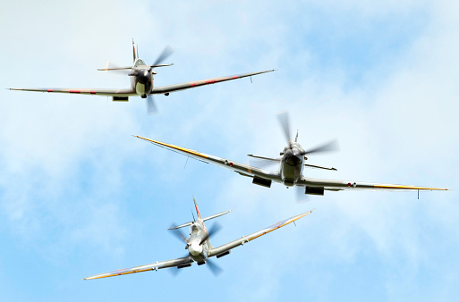 Three Royal Air Force Spitfire fighter planes in attack formation.To see my other aviation images please click the image below