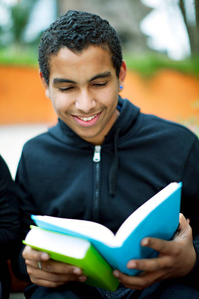 istock Teenage Boy Reading 174901676
