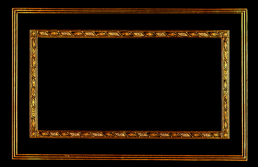 A gold frame against a black background.