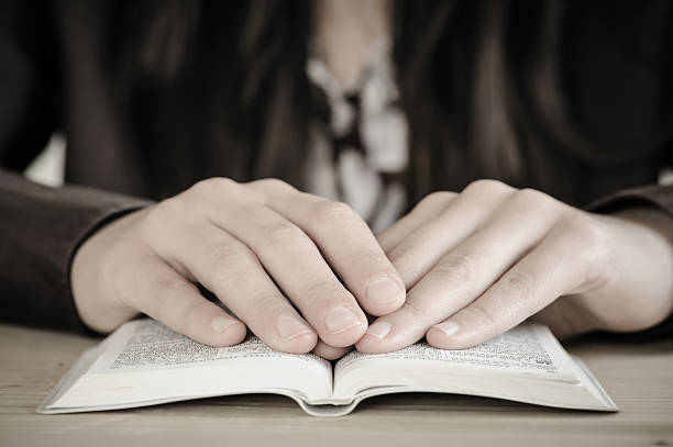 istock Woman reading from the Bible. 174902404
