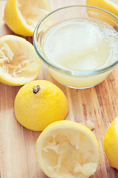 istock Fresh Lemons with Lemon Juice 174903477