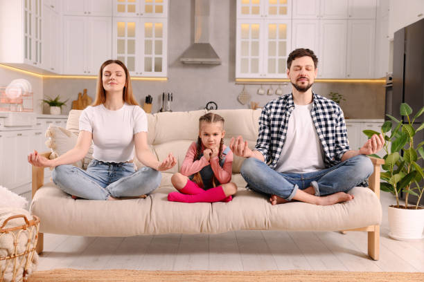 istock Parents meditating while their daughter getting bored at home. Harmony and zen 1749036685