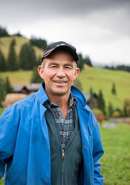 istock smiling farmer in Swiss Alps 174903956