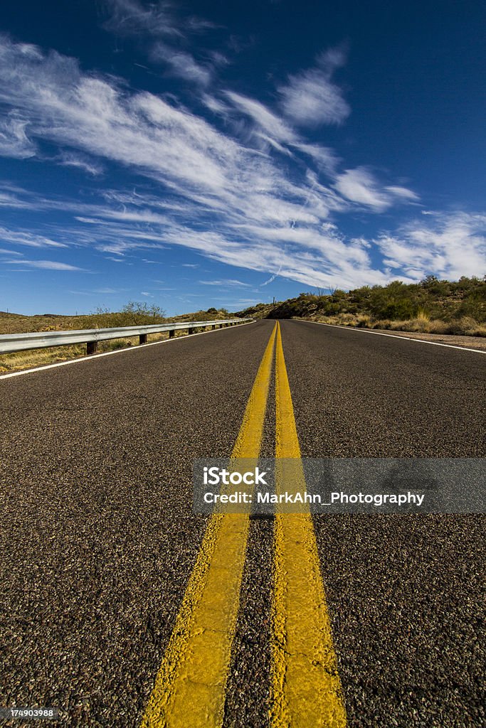 Road To Nowhere Isolated road in the Arizona desert. Desert Area Stock Photo
