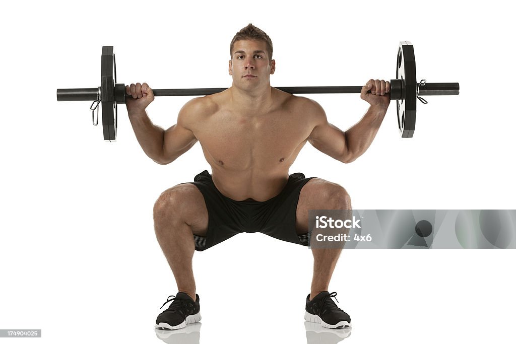 Homme musclé exercer avec barre - Photo de Exercice physique libre de droits