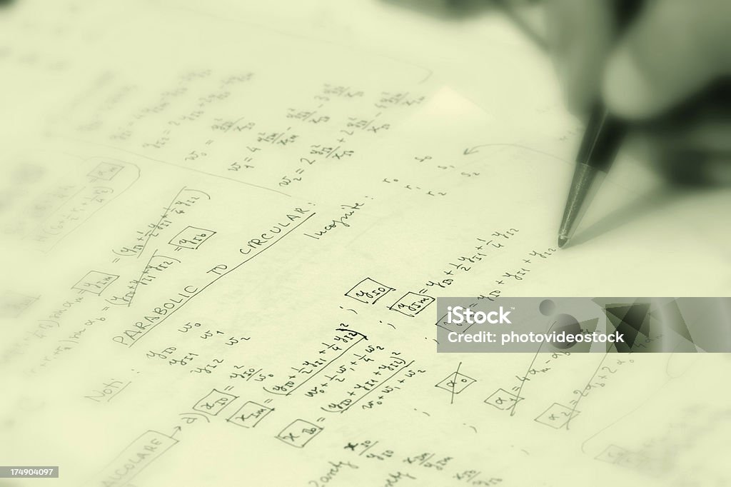 Rocket science! Man's hand holding pen and doing mathematical calculus. Kidney Stone Stock Photo