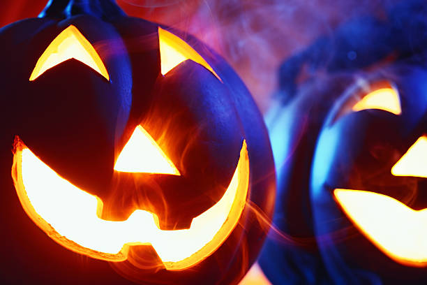 istock Halloween pumpkins in dark blue with spider web and smoke 174904125