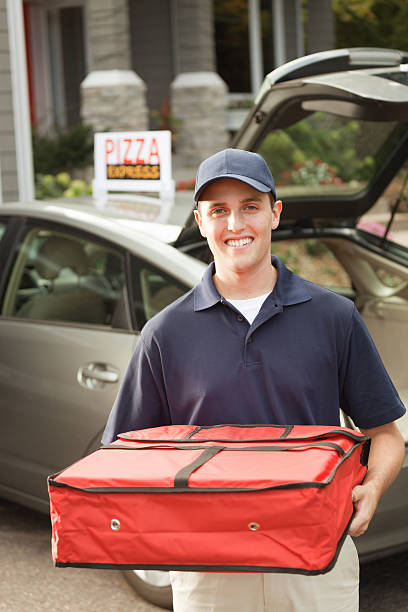 istock Happy Smiling Pizza Delivery Man with Package Vt 174904168