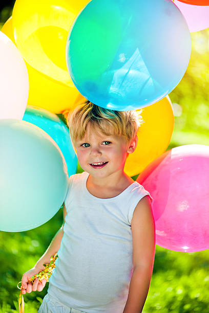 istock Cute boy with balloons 174904386