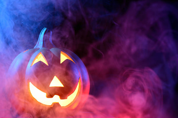 istock Halloween pumpkin with colorful smoke 174904926
