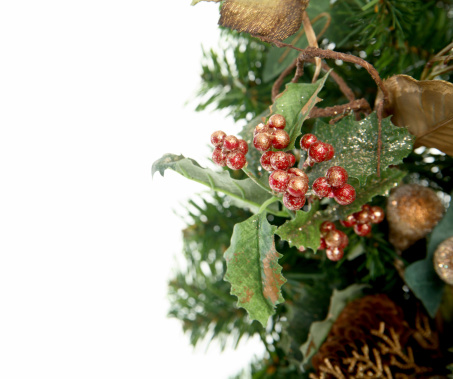 A Christmas decoration isolated on the side of a white background perfect for copy space.