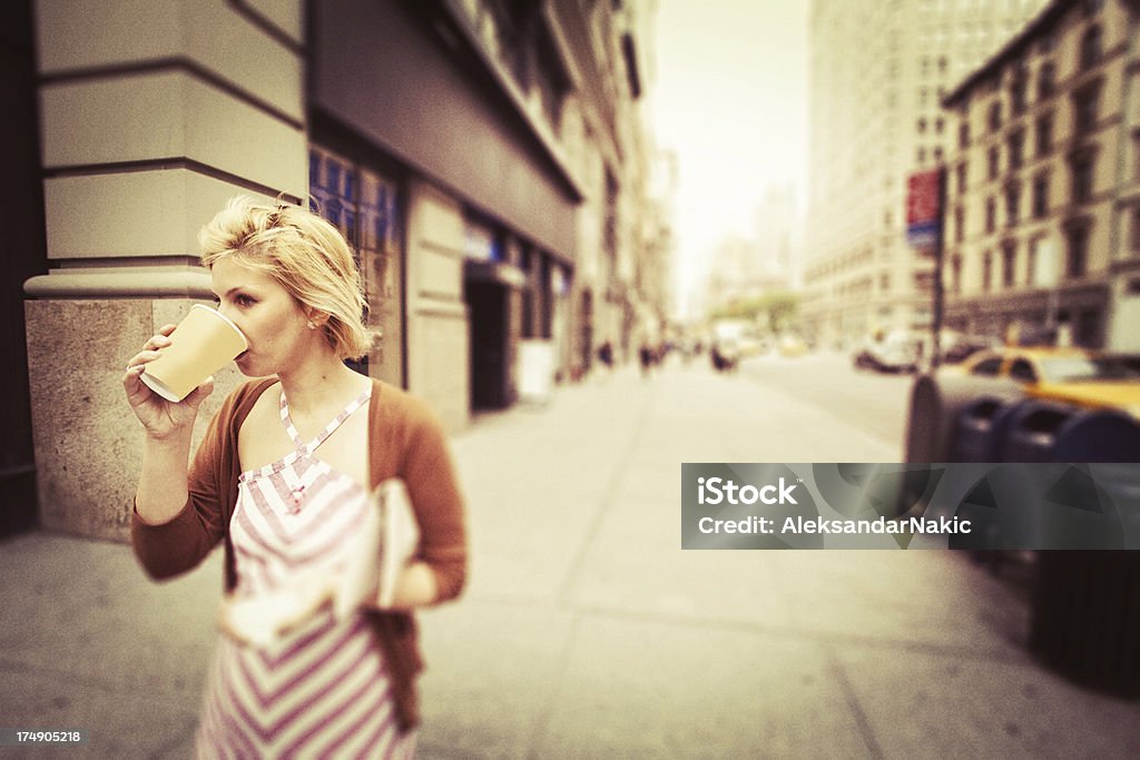 New York City Woman New York City woman having her first morning coffee**Photo taken with Canon 5D mark II and retouched as Iphone photo. Mobilestock * Grainy effect added Blond Hair Stock Photo