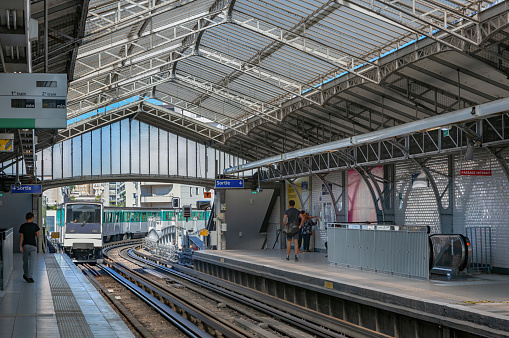 Berlin, Germany - November 9, 2019: Passengers moving through modern main railway station at Berlin Hauptbahnhof.