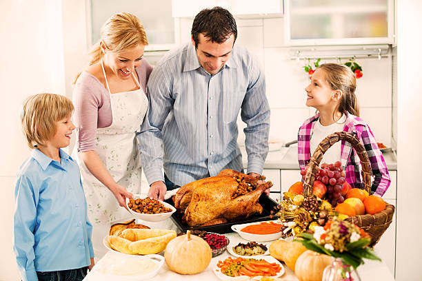 istock Young family celebrating Thanksgiving day. 174905941