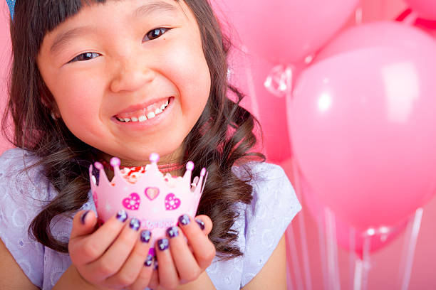 istock Young girl holding a cupcake 174905967
