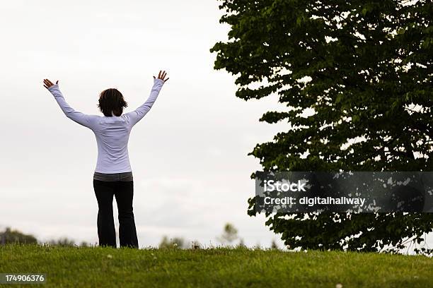 Mature Woman Worshipping Outdoors Stock Photo - Download Image Now - 45-49 Years, Adult, Adults Only