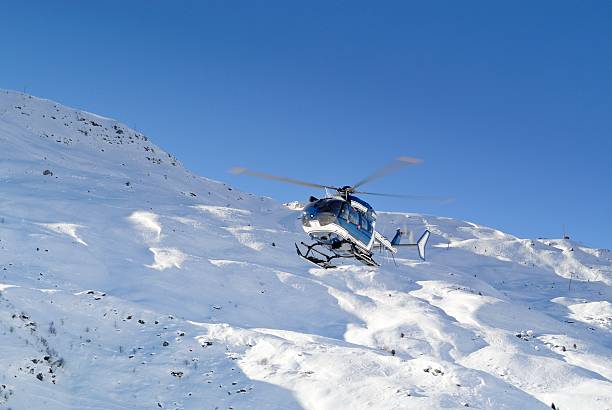 Zell am See, Austria - March 22, 2012: Medical helicopter at airport and airfield. Rotorcraft and medicopter. General aviation industry. Air ambulance transportation. Air transport. Fly and flying.